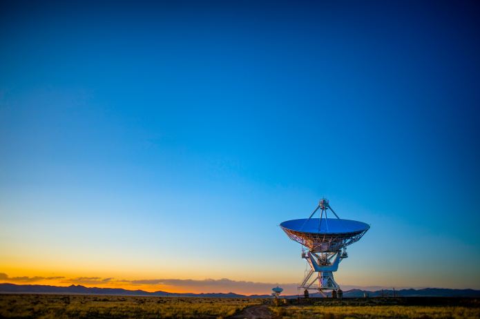 Photo of satellite dish at dawn